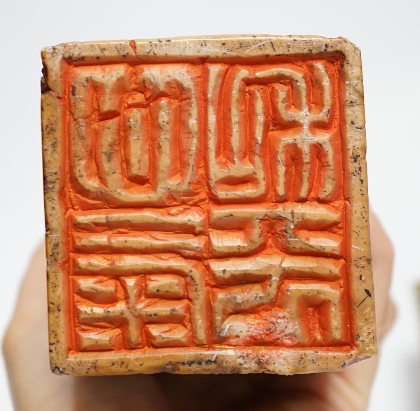 A large Chinese soapstone 'dragon' seal and a smaller seal, cased (2), tallest 20cm